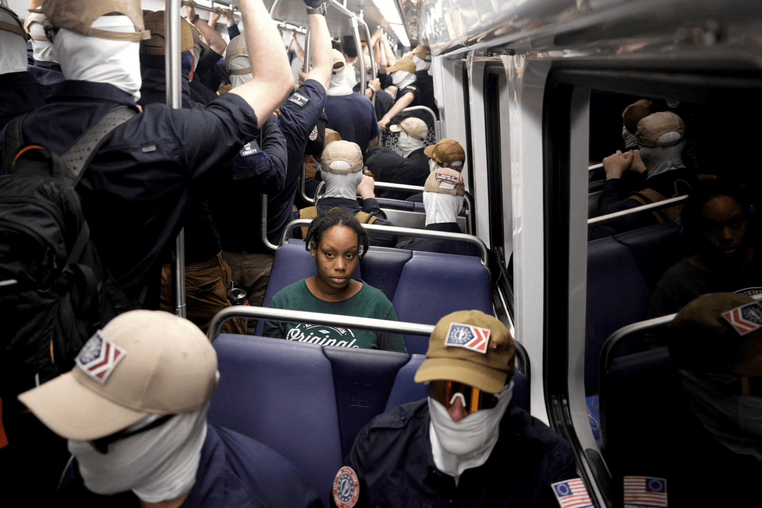 Black Passenger surrounded by White nationalist on subway train